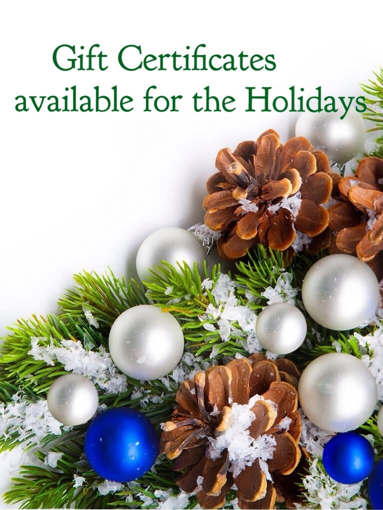 A christmas wreath with blue and white ornaments.